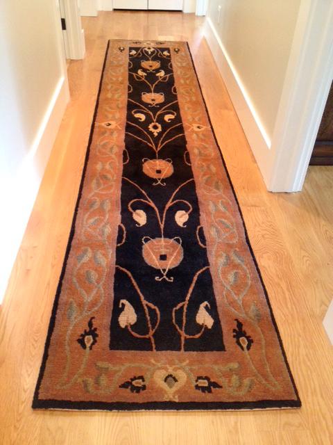 estate evening rug installed in a hall as a runner